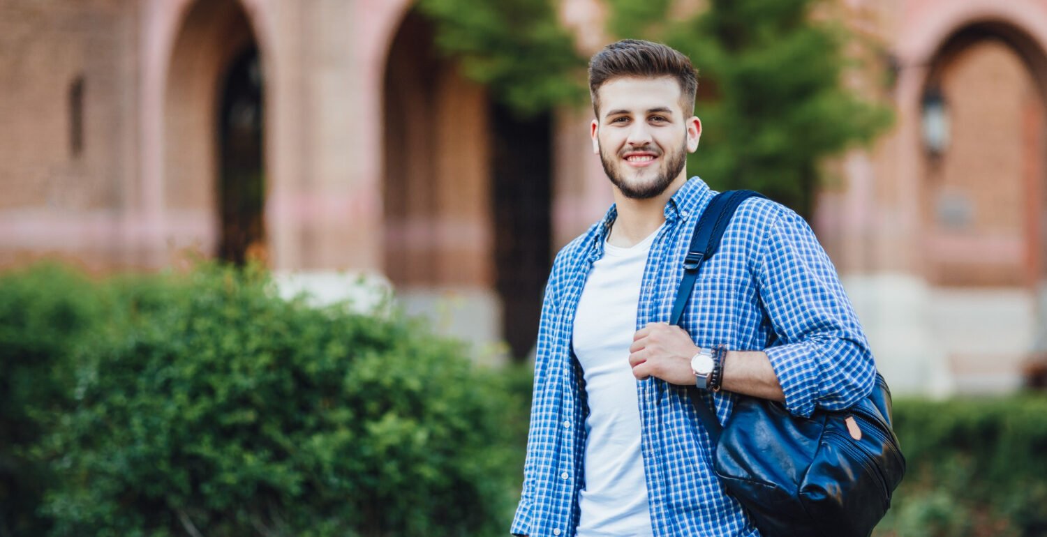 young-man-sunglasses-white-shirt-with-gray-pants-speaking-his-phone-with-cup-cofee